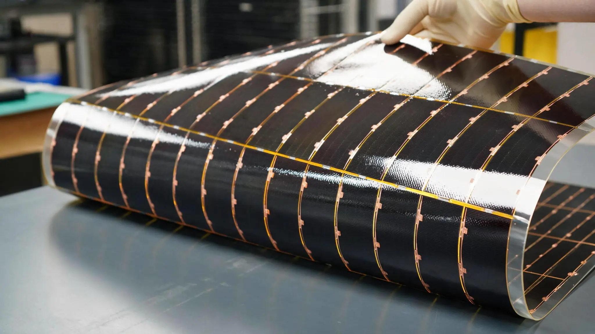 Rolled flexible photovoltaic blanket illustrating Heliofold's future system direction